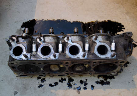 The head of the block of cylinders. The head of the block of cylinders removed from the engine for...