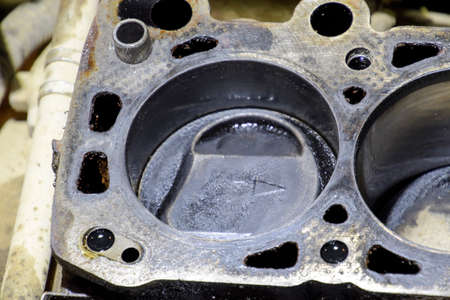The cylinder block of the four-cylinder engine. Disassembled motor vehicle for repair. Parts in...