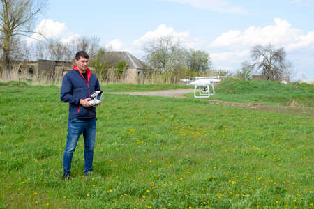 A man with a remote control in his hands. Flight control of the drone. Phantom.