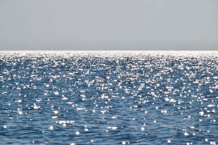 Sea line of the horizon. Sea and sky. The waves and glare of the sun are reflected from the waves of the sea. Seascapeの写真素材