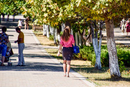 Novorossiysk, Russia - September 05, 2016: A blonde girl with a beautiful booty walking down the street.のeditorial素材