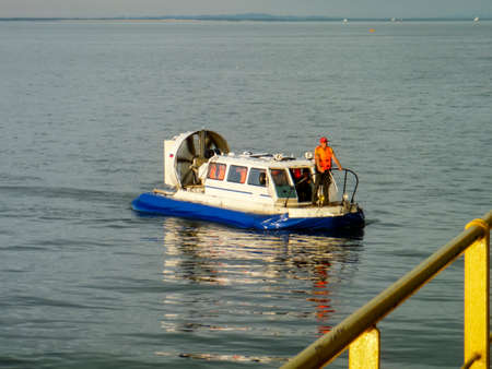 A small service ship in a cargo industrial port. A ship in the sea.の写真素材
