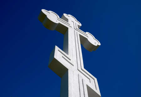White orthodox christian cross on blue sky backgroundの写真素材