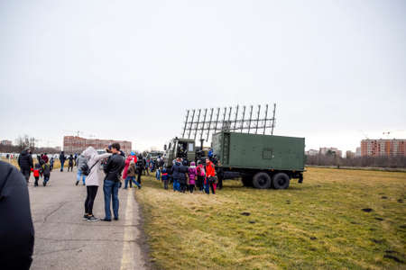 Krasnodar, Russia - February 23, 2017: Exhibition of military equipment at the Krasnodar airfield. Viewers inspect Military cars and a mobile radar station.のeditorial素材