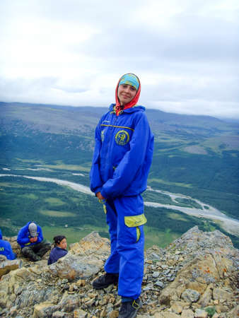Altai, Russia - August 01, 2007: Girl tourist at the top of the cliff.のeditorial素材