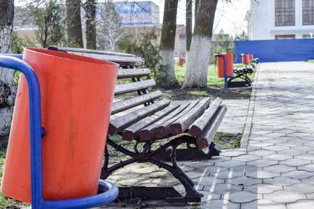 A brown bench in the park. The park infrastructure. Walking in the parkの写真素材