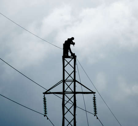 Power line support, insulators and wires. Appearance of a design. Assembly and installation of new support and wires of a power line.の写真素材