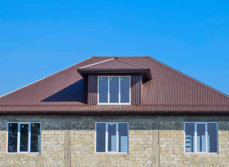 House of cinder block. The house with plastic windows and a roof of corrugated sheet. Roofing of...
