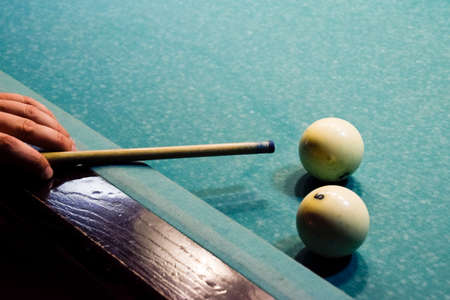 Billiards, billiard table. Targeting the cue in the ball for impact.の写真素材