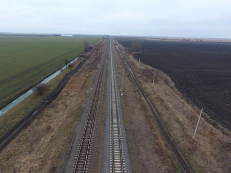 Plot railway. Top view on the rails. High-voltage power lines for electric trains.の写真素材