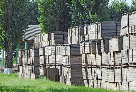Wooden boxes stacked together. Warehouse empty wooden containers.の写真素材