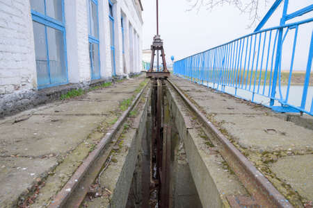 Slot lock water pumping station. Lock bolts. Hydraulic construction