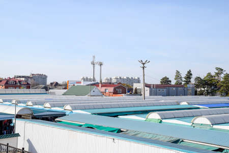 Slavyansk-on-Kuban, Russia - November 8, 2016: covered market in the city. Rows of sales outlets. View from the bridge to the city market.のeditorial素材