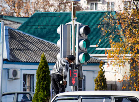 Slavyansk-na-Kubani, Russia - September 9, 2016: Electrical repairs traffic light at the...