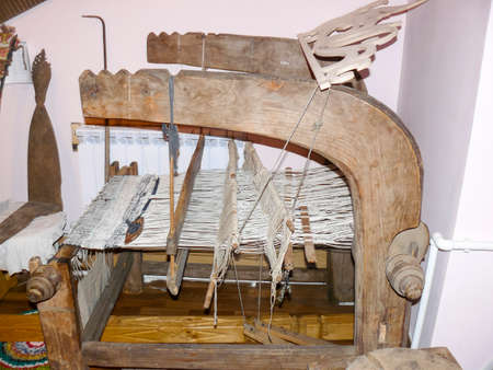 Ancient wooden loom. Ancient textile a equipment