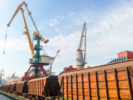 Novorossiysk, Russia - August 20, 2017: Freight railroad cars in the industrial port. Wagons hoppers