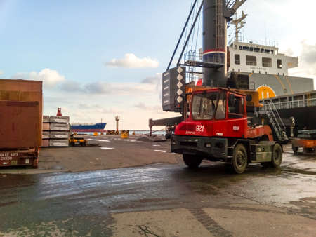 Novorossiysk, Russia - August 20, 2017: The port loader in the port drives around the site.のeditorial素材