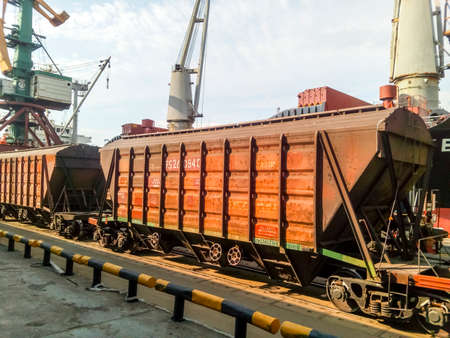 Novorossiysk, Russia - August 20, 2017: Freight railroad cars in the industrial port. Wagons hoppersのeditorial素材