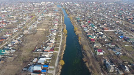 View from the top of the village. Streets without asphalt and single-storey houses. The Kuban...