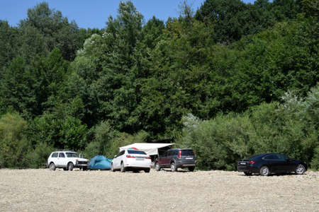 Shapsugskaya, Russia - July 30, 2016: Camping in nature. Departure by car to the nature to the river in the forest.のeditorial素材