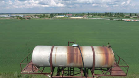 The water tower. An old rustic communal communication.の写真素材