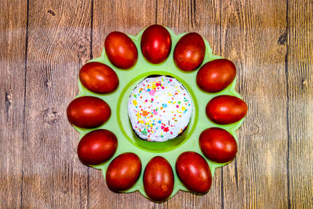 Easter cake and painted red Easter eggs. Food for the Easter tableの写真素材