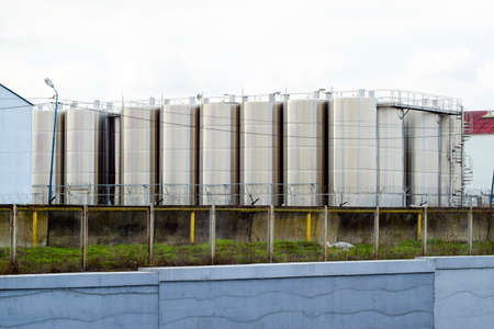 Stainless steel tanks at the winery. Winery. Wine and alcoholic beverages production.の写真素材