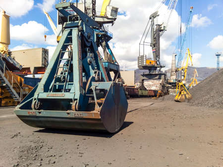 Novorossiysk, Russia - October 10, 2017: Clamshell bucket in the cargo port. Bucket for loading coal.のeditorial素材