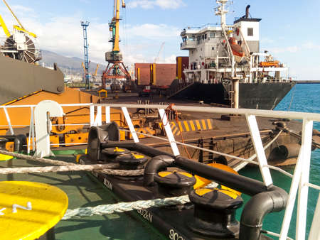 Mooring bollard on the decks of an industrial seaport