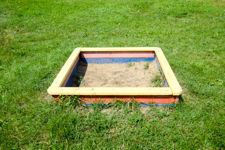 Children's sandbox. Children's playground. Swing, carousel and slideの写真素材