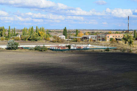 Old abandoned buildings of the former factory and warehouses. The destroyed essential oil plant. Soviet heritage. Old brick buildings. Settlement in the Kubanの写真素材