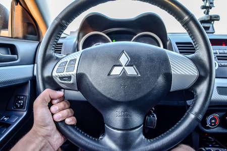 Krasnodar, Russia - September 6, 2016: Behind the wheel of the car Mitsubishi lancer 10th generation.のeditorial素材