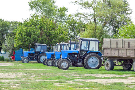 Russia, Temryuk - 15 July 2015: Tractor, standing in a row. Agricultural machinery. Parking of agricultural machineryのeditorial素材