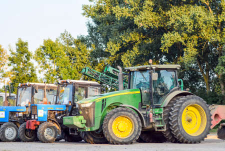 Russia, Temryuk - 15 July 2015: Tractor, standing in a row. Agricultural machinery. Parking of agricultural machineryのeditorial素材