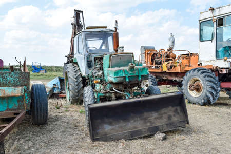Russia, Temryuk - 15 July 2015: Tractor. Bulldozer and grader. Tractor with a bucket for digging...