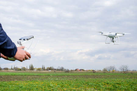 A man with a remote control in his hands. Flight control of the drone. Phantom.