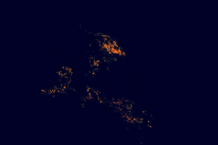 Fire. Burning of rice straw at night.の写真素材