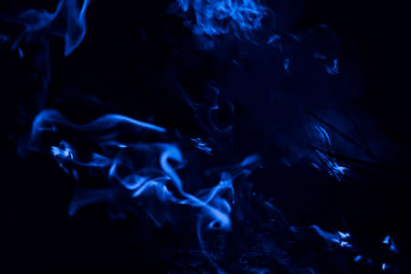 Blue flame. Fire. Burning of rice straw at night.の写真素材