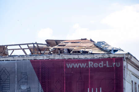 Novorossiysk, Russia - September 29, 2017: Wind-blown roof from the building. Destruction of the...