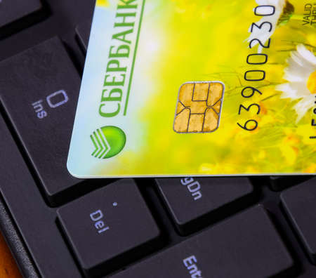 Krasnodar, Russia - March 12, 2016: Credit card lying on black computer keyboardのeditorial素材