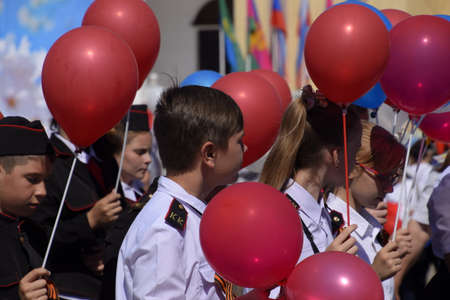 Slavyansk-on-Kuban, Russia - May 1, 2018: Celebrating the first of May, the day of spring and work. May Day parade on the Theater Square in the city of Slavyansk-on-Kuban.のeditorial素材