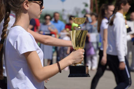 Slavyansk-on-Kuban, Russia - May 1, 2018: Young athletes with their awards at the festive May procession.のeditorial素材