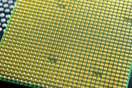 Computer processor, contact feet. Electronic board with electrical components. Electronics of computer equipment.の写真素材