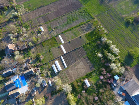 The gardens in the spring. The views are from the top. Greenhouses in the garden.の写真素材