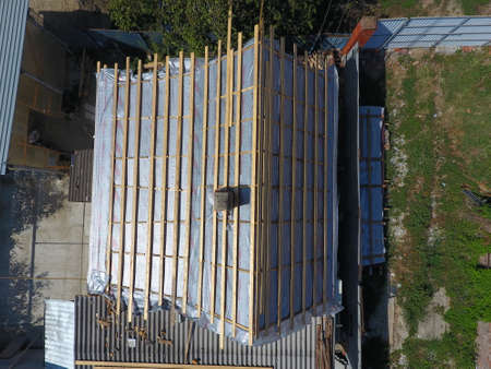 Slavyansk-on-Kubani, Russia - September 10, 2017: Repair of the roof of the house. Moisture insulation under metal.のeditorial素材