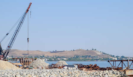 Construction of the Crimean bridge. Piles of rubble and cranes lifted. Construction and repair....