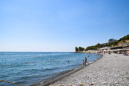 Novorossiysk, Russia - August 06, 2018: Shirokaya Balka Sea beach near the city of Novorossiysk. Infrastructure of the beach. Holidaymakers on the beach.のeditorial素材