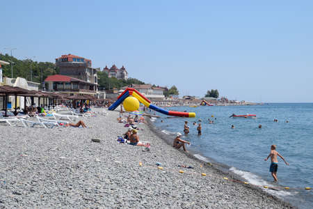 Novorossiysk, Russia - August 06, 2018: Shirokaya Balka Sea beach near the city of Novorossiysk. Infrastructure of the beach. Holidaymakers on the beach.のeditorial素材