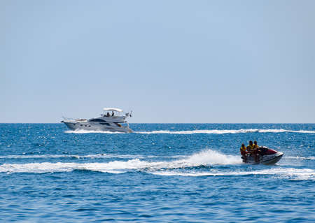 Novorossiysk, Russia - August 06, 2018: Motor transport in the sea, cutter hydrosculator and boatのeditorial素材