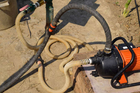 Self-priming garden pump and hose system connected to it